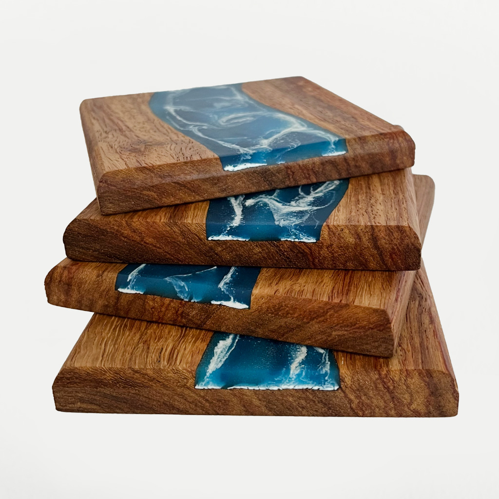 Side views of Sunbird Stories Tidal collection coaster set showing inlaid resin artwork