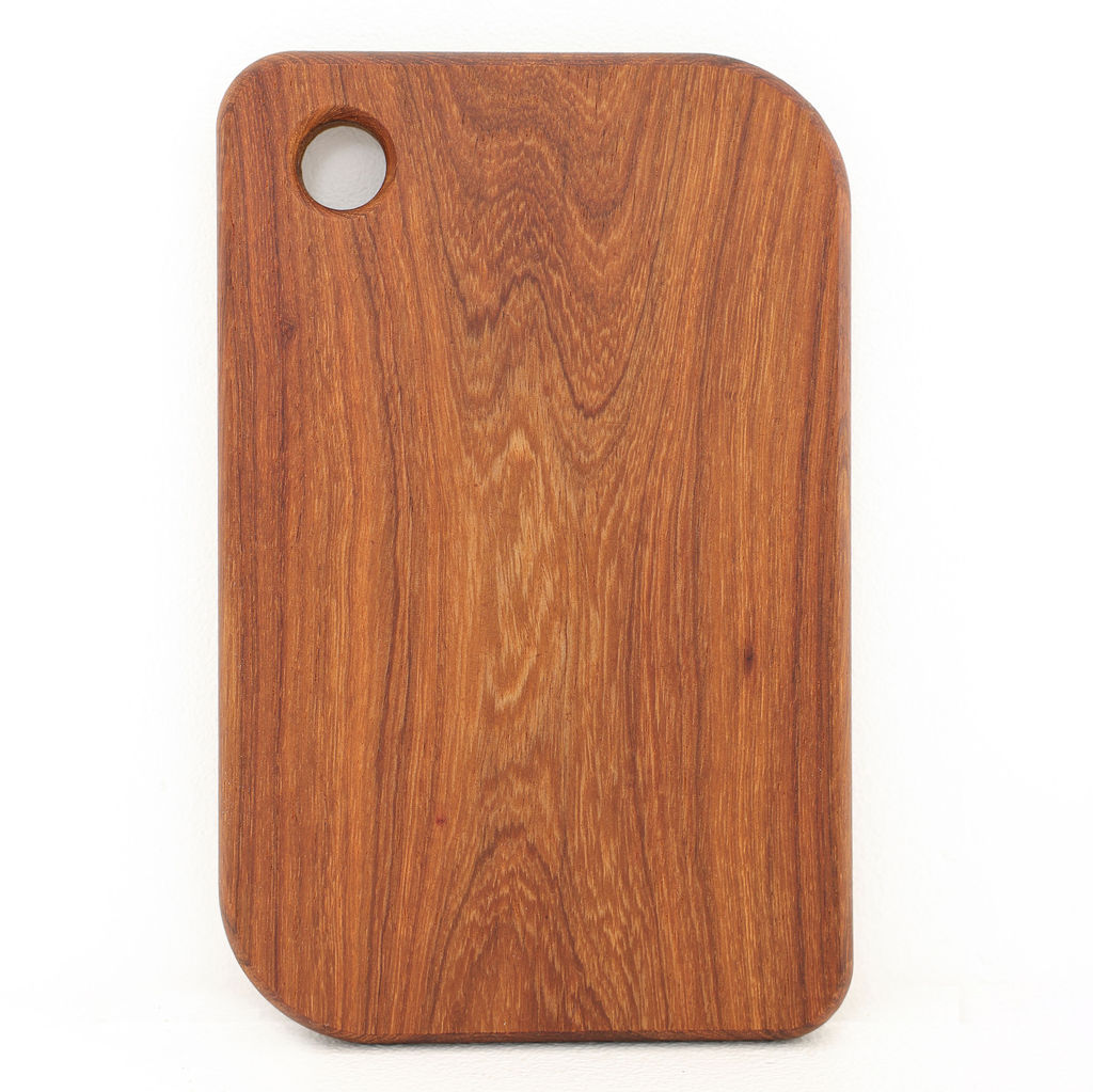 Front view of handcrafted Grain small rectangle kiaat wood serving board