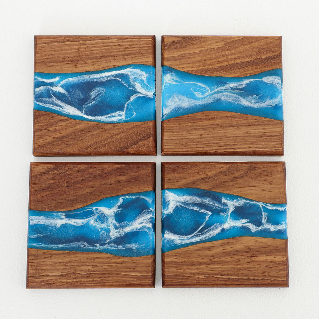 Front view of handcrafted Tidal coaster set with inlaid blue ocean resin wave design